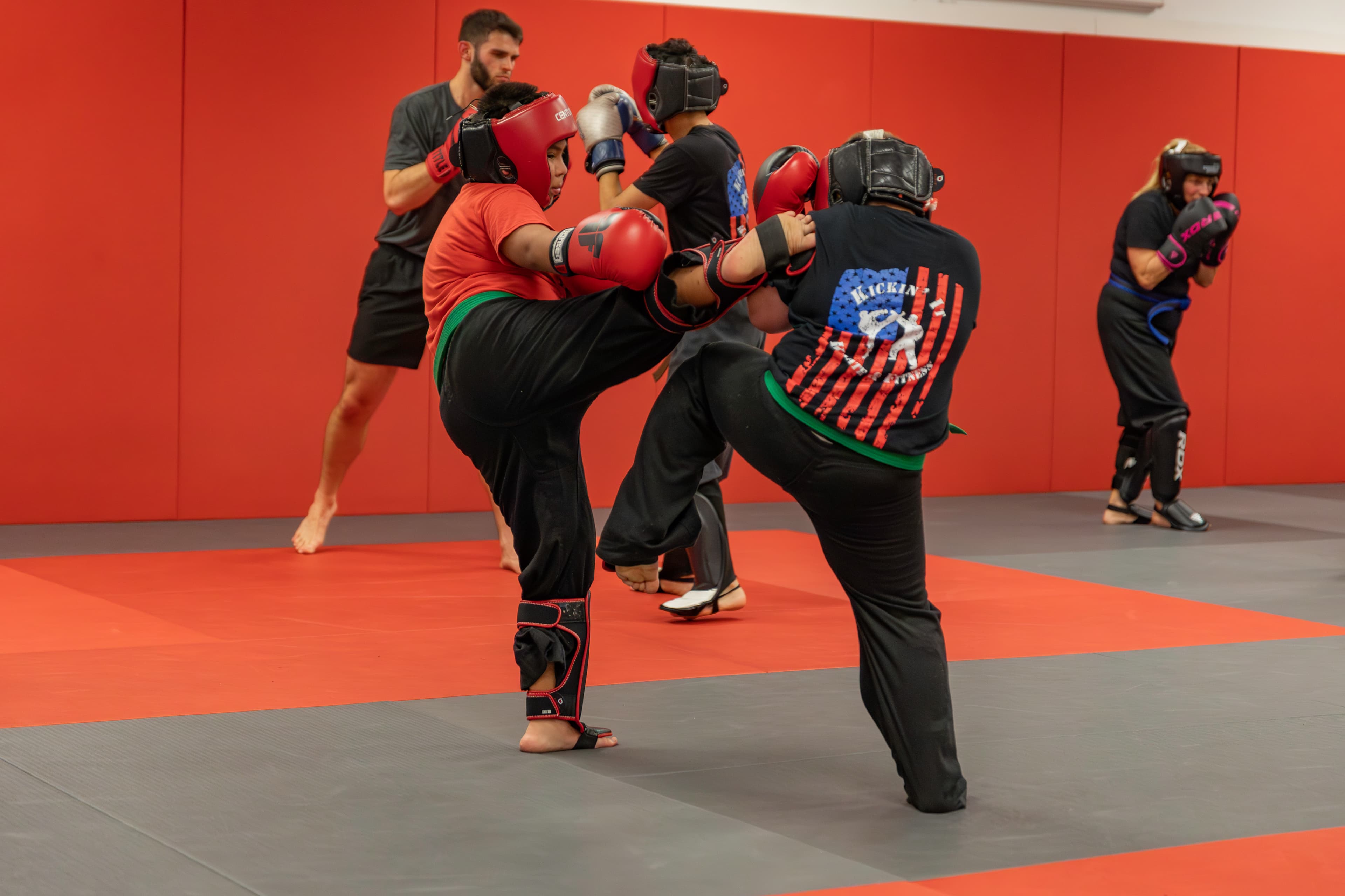 Kids and adults sparring in class at Kickin' It Karate & Fitness in Bradenton